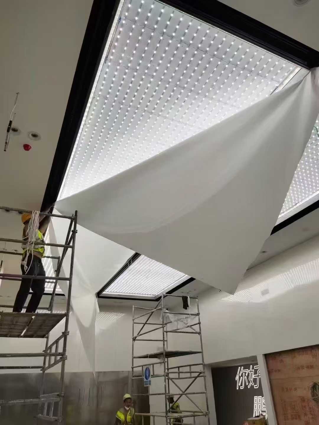 UV soft film backlit display in shopping mall interior